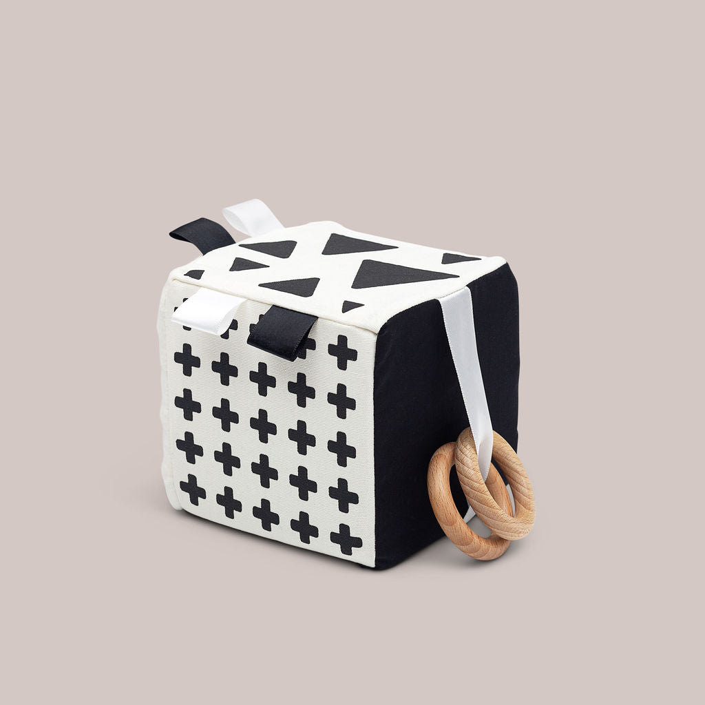 Sensory Cube toy for babies with black and white features.