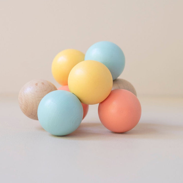 Wooden hand beads for developing babies fine motor skills and to promote grasping.